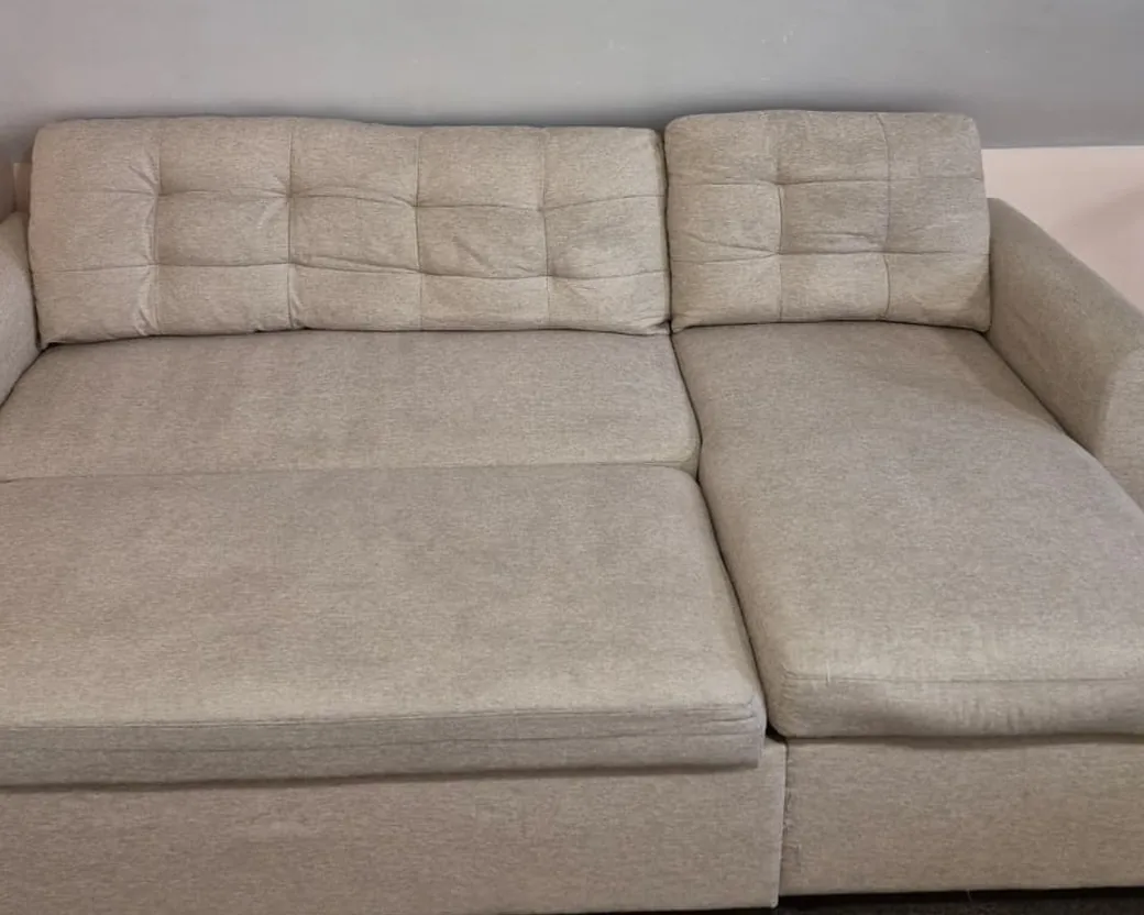 Beige sectional sleeper sofa after cleaning