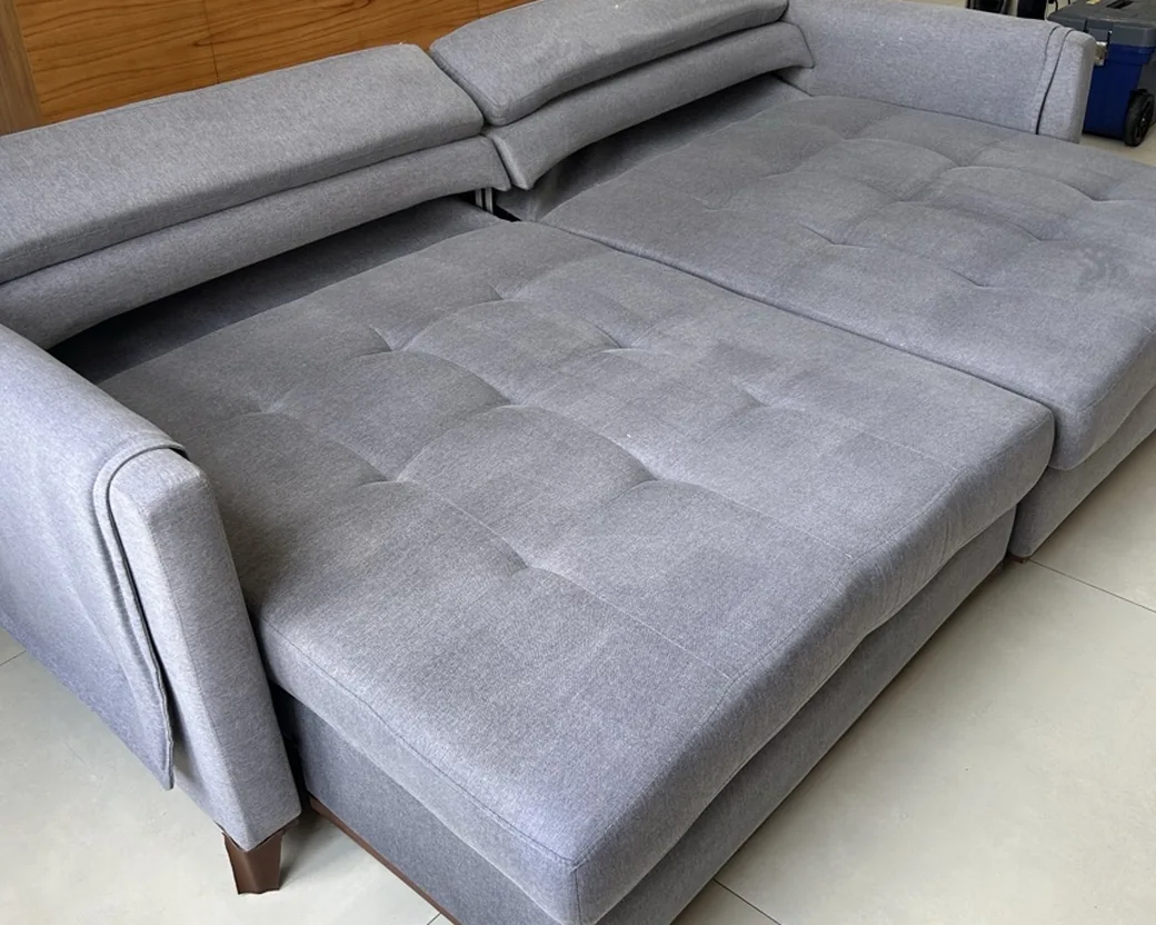 Gray sectional sofa bed after cleaning